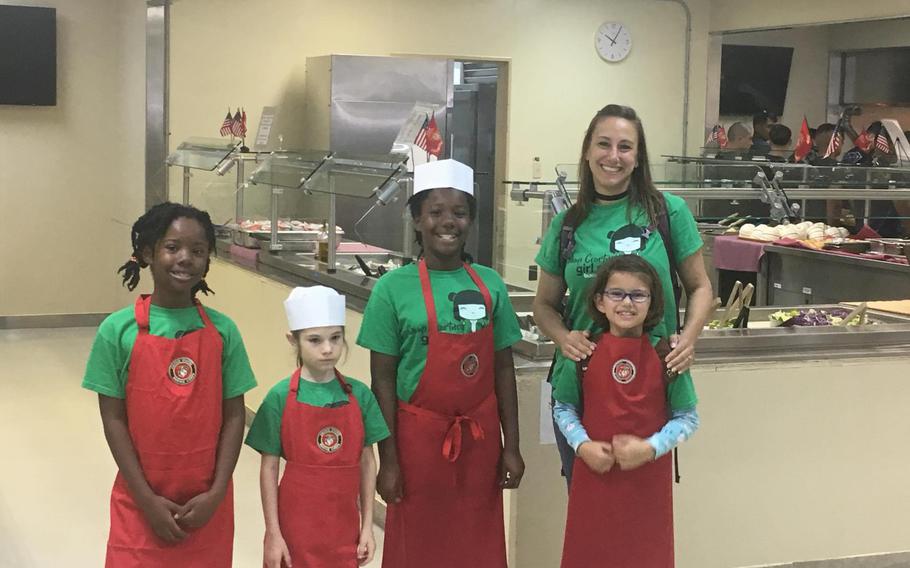 A Brownie troop toured Camp Hansen Chow Hall to experience a day in the life of a Marine chef!