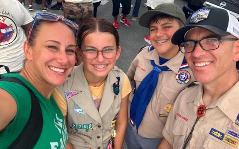 Photo Of Jeff and Steph are active in their kids’ scouting experiences on Okinawa. The four walked in the Veterans Day parade, Kadena Air Base in November.