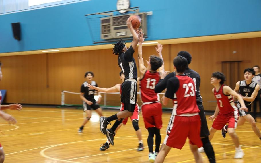 The Zama Middle High School boys basketball teams plays against Okinawa Christian School International Jan 30 during the Department of Defense Education Activity -Pacific Far East Division II Boys Basketball Tournament held at the Yano Fitness Center on Camp Zama. (Noriko Kudo, U.S. Army Garrison Japan Public Affairs)