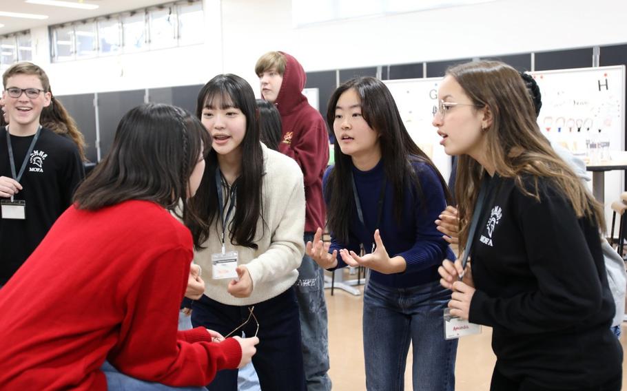 U.S. and Japanese high school students play a game during the Student Educational Exchange and Dialogue event Dec. 3 at Zama Middle High School on Camp Zama, Japan. The Department of Defense Education Activity Pacific Region and the Ministry of Foreign Affairs of Japan jointly hosted the event. (Noriko Kudo, U.S. Army Garrison Japan Public Affairs)