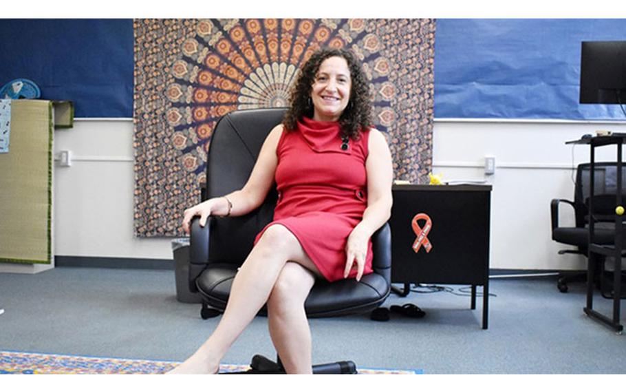 Tisha Miller, the Adolescent Support and Counseling Services counselor at Zama Middle High School, poses for a photo in her office at the school on Camp Zama, Japan. (Photo by Winifred Brown, US Army Garrison - Japan.)