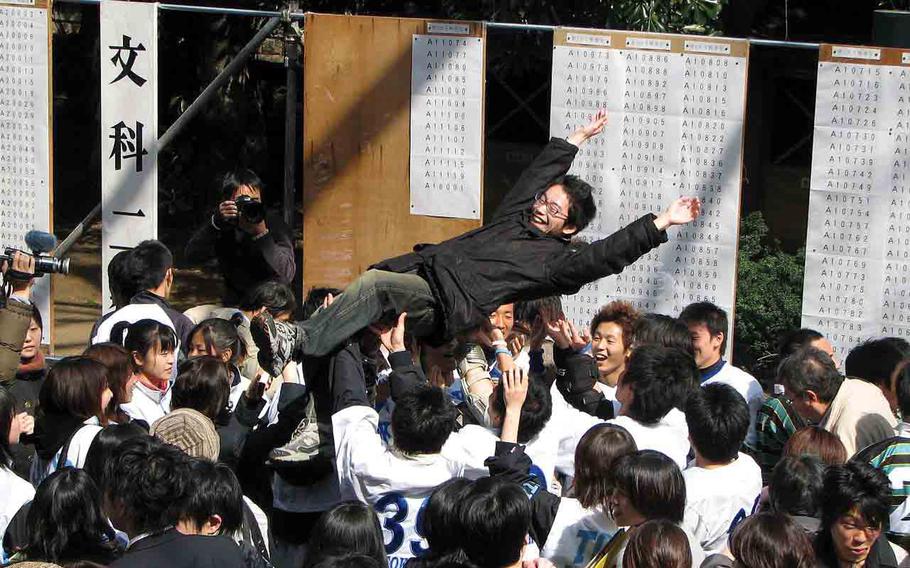 Students celebrating entrance exam pass