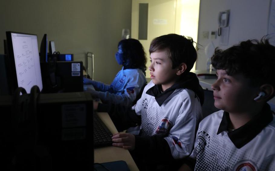 Members of Zama Middle High School's esports team gather in one of the school's computer rooms at Camp Zama, Japan, Feb. 3, 2023. The team recently wrapped up its inaugural season, which had players competing virtually against other schools in a multiplayer video game. (Photo Credit: Sean Kimmons)