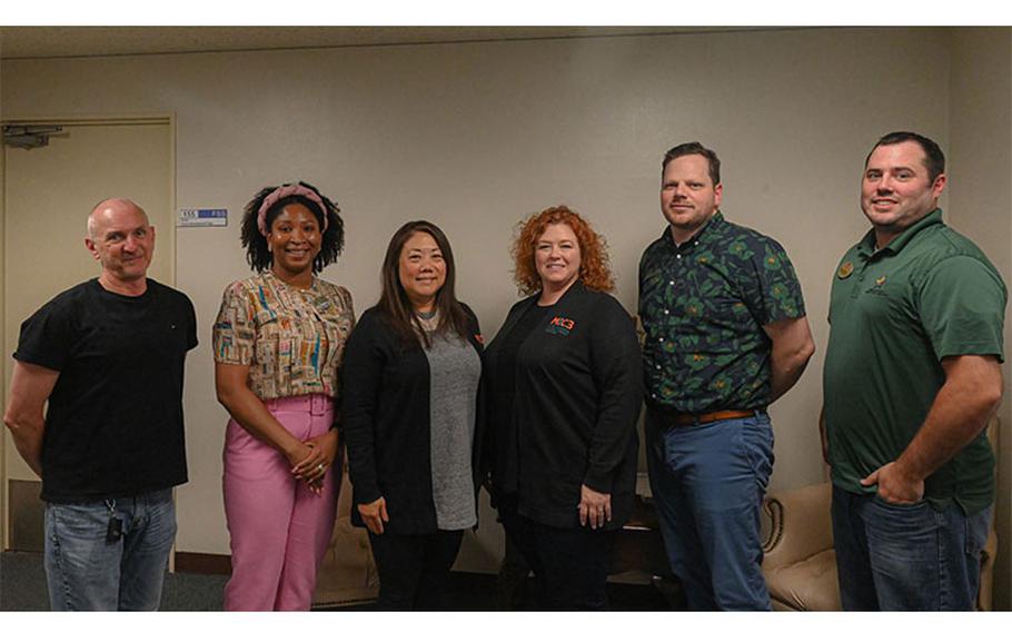 Military Interstate Child Compact Commission (MIC3) team poses for a photo after a meeting with parents from Yokota Air Base, Japan, May 10, 2023. The Compact is designed to help U.S. military kids transition from one school district to another due to military moves. While at Yokota, they addressed challenges most commonly related to eligibility, enrollment, placement, and graduation. (U.S. Air Force photo by Senior Airman Manuel G. Zamora)