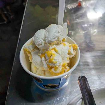 Coconut ice cream with sweet egg topping at Ni-Ang Ice Cream in Bangkok, Thailand