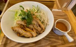 A pho dish is on the table.