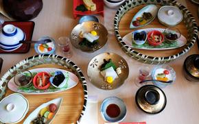 A traditional kaiseki breakfast of pickles, side dishes, sashimi, rice and miso soup and grilled fish at an onsen ryokan (guesthouse/inn) in Hakone, Japan.