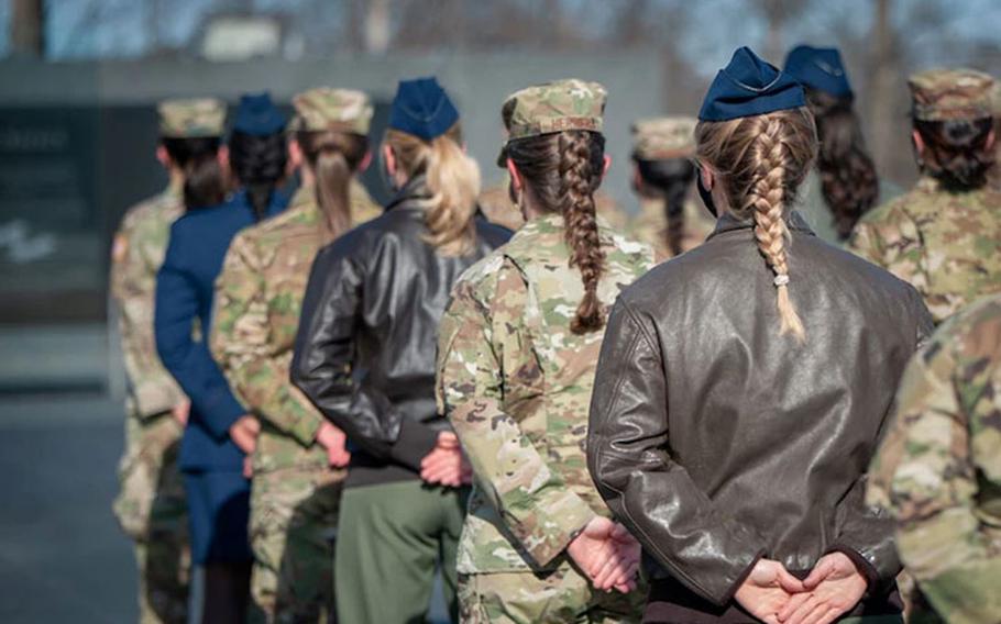 As an outcome of the 101st Air Force uniform board, Air Force women will be able to wear their hair in up to two braids or a single ponytail with bulk not exceeding the width of the head and length not extending below a horizontal line running between the top of each sleeve inseam at the under arm through the shoulder blades. In addition, women’s bangs may now touch their eyebrows, but not cover their eyes. These new changes will be effective upon publication of the new standards in Air Force Instruction 36