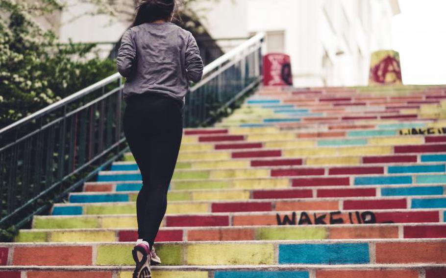 Person running up steps