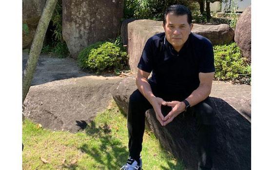 Photo Of Hilary Valdez is having a seat on a rock in sunny daytime.