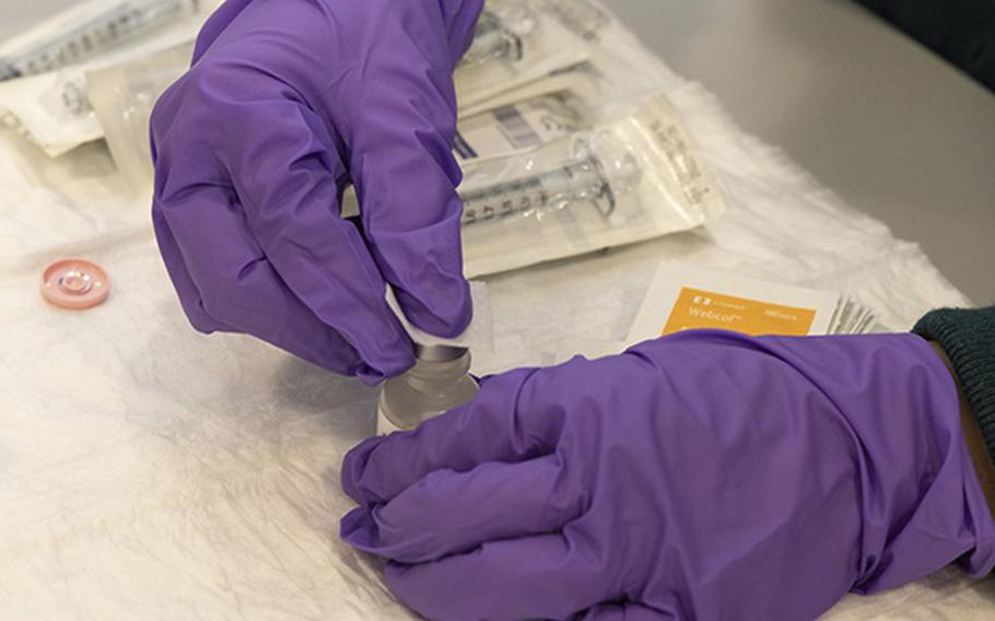 A research coordinator at the Walter Reed Army Institute of Research Clinical Trials Center prepares samples prior to the RV575 research study on Sept. 27, 2022. The U.S. Military HIV Research Program launched the phase 1 study, in October, to evaluate varying doses of the Army's novel ALFQ adjuvant in a candidate HIV vaccine to determine the optimal adjuvant dosage level. Since 1986, the U.S. military has been at the forefront of the battle against HIV. (Photo: Mike Walters, U.S. Army)