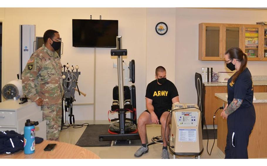 Army Staff Sgt. William Cox, an instructor in the occupational therapy assistant program at the Medical and Education Training Campus at Joint Base San Antonio-Fort Sam Houston, observes a student practicing convective thermal therapy (Photo by: London Prince / Medical and Education Training Campus Protocol Assistant, Joint Base San Antonio-Fort Sam Houston).