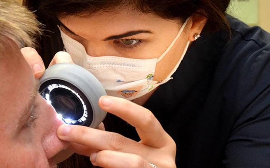 Elizabeth Anderson, a physician assistant at Naval Hospital Jacksonville’s Dermatology Clinic, uses a lighted scope to check a patient’s skin. “Skin cancer rates are high in Florida, and it’s important to self-check monthly,” Anderson said. Skin cancer is the most common cancer in the U.S. To reduce risk, protect your skin from UV rays from the sun, tanning booths, and sunlamps. (Photo: Deidre Smith, Naval Hospital Jacksonville)