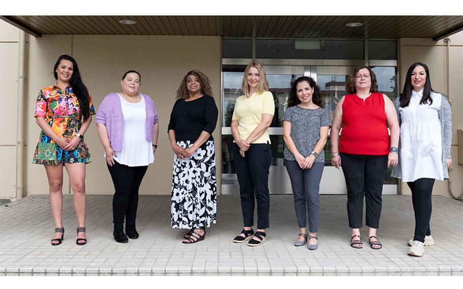 True North program managers and social workers pose for a group photo outside the 374th Airlift Wing headquarters building at Yokota Air Base, Japan, July 28, 2022. The True North mission is to provide highly accessible social workers and chaplains that provide limited counseling to uniformed unit members, promote positive help-seeking culture, teach resilience skills, and act as guides to helping members get elevated care when needed. (U.S. Air Force photo by Staff Sgt. Ryan Lackey)