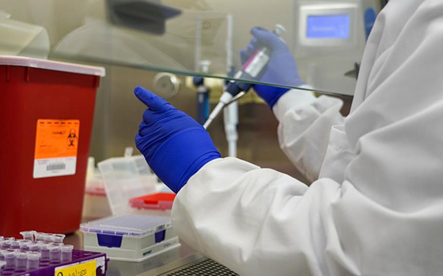 A lab technician at the Naval Health Research Center prepares samples for whole genome sequencing. The DOD SARS-CoV-2 Whole Genome Sequencing Action Plan brings together laboratories to conduct whole genome sequencing across the Military Health System in response to the COVID-19 pandemic.