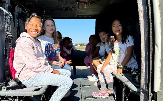 Photo Of Girls enjoy a helicopter tour at U.S. Army Garrison Wiesbaden.