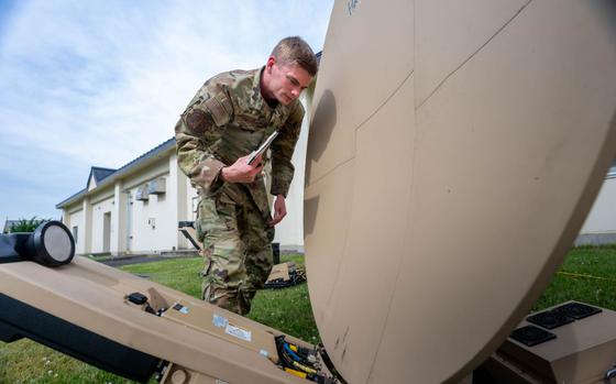 U.S. Air Force Senior Airman Aaron Dirig troubleshoots a Hawkeye III Lite satellite system Rapid Response Communications Kit at Misawa Air Base.