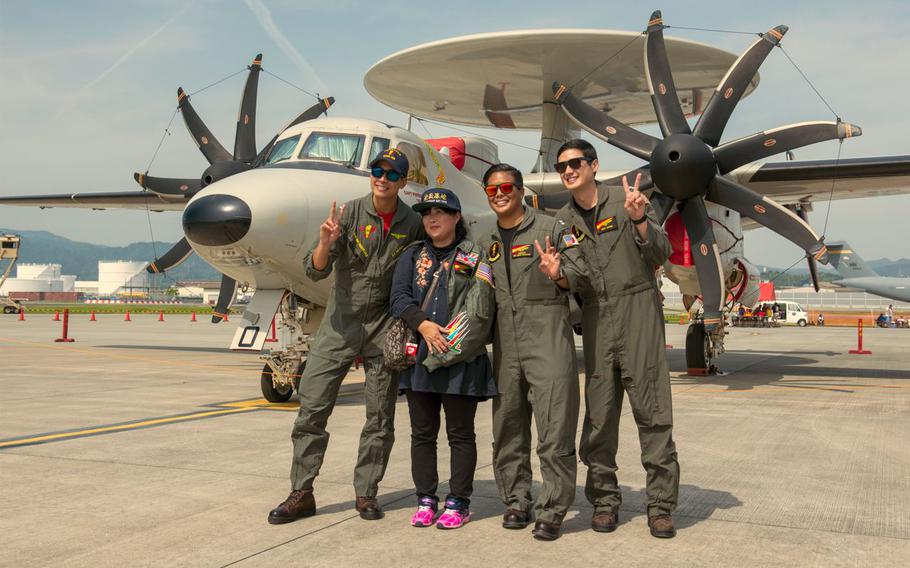 attendee, marines and JMSDF members posing for a photo during JMSDF-MCAS Iwakuni Friendship Day