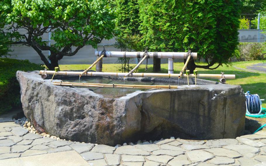 A place for you to rinse your mouth and wash your hands before going in the sacred area.