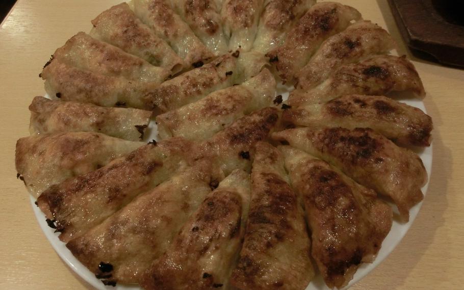 22 gyoza are on the dish.