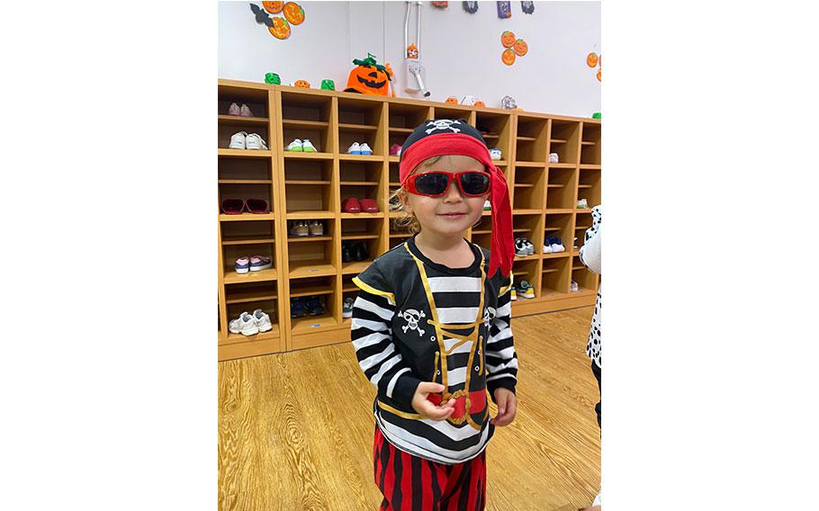 a kid wearing a costume of a pirate.