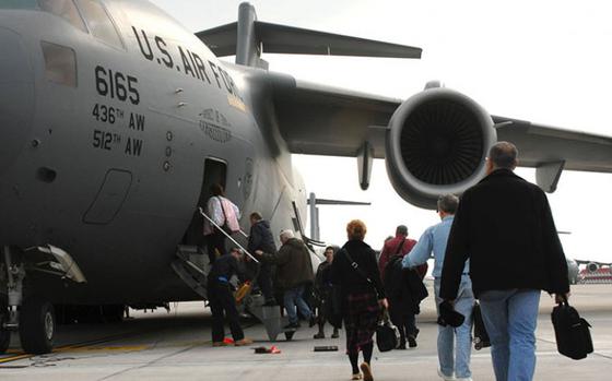 Passengers get on a plane.
