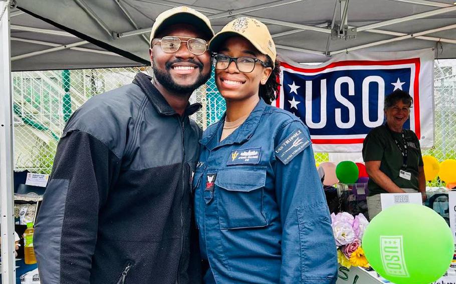 Dual military couple at the USS Tripoli Homeport Change event.