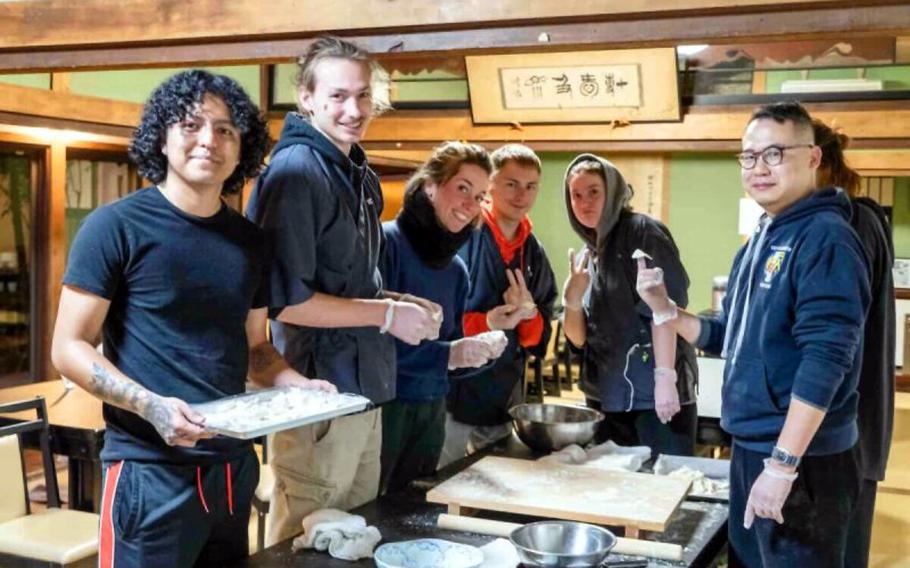 Participants in the udon making pose for a photo.