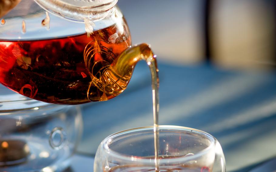 Tea in a teapot, glass teapot, Cup, close-up