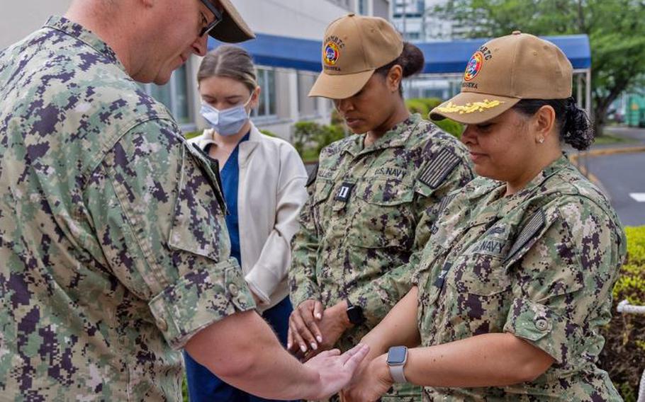 United States Navy Medicine Readiness and Training Command (USNMRTC) Yokosuka’s Command Chaplain, LT Jeremy Carr conducted a Blessing of the Hands for USNMRTC nurses and staff to kick off National Nurses Week. National Nurses Week is an annual event that takes place from May 6 to May 12, which coincides with the birthday of Florence Nightingale, who was a nurse leader who established the world’s first nursing school. The week-long celebration is a time to recognize and honor the contributions of nurses and to raise awareness of their vital role in patient care. 