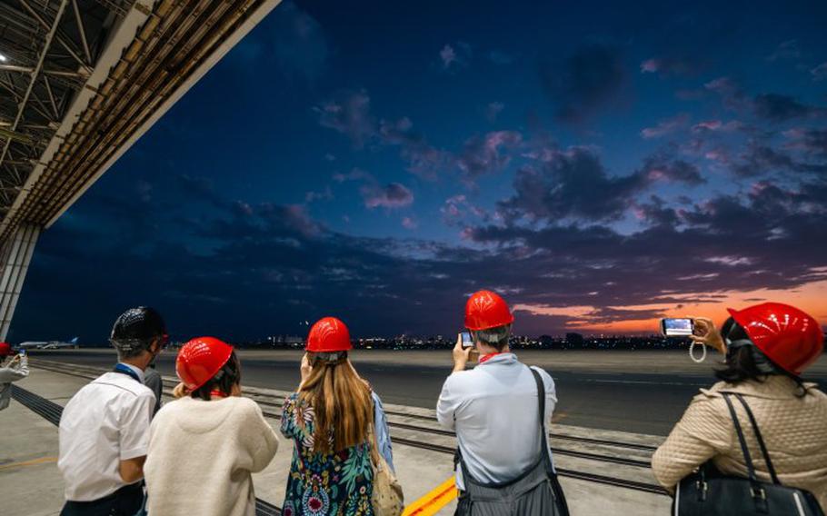 Participants with helmets on their heads record the runways.