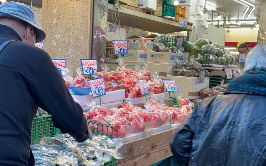 a vegetable store in the street.