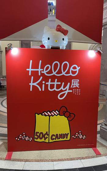 hello kitty can be seen above the flyer promoting the exhibition.