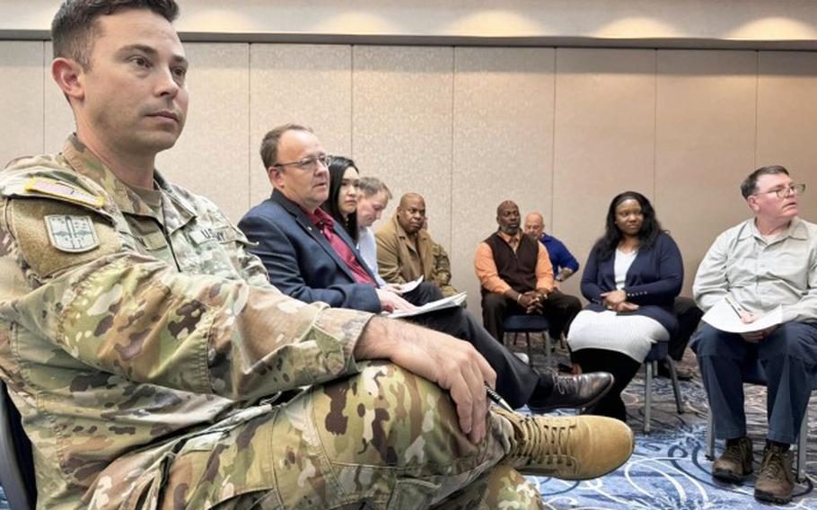 Attendees listen to a presenter during the Community Information Exchange held Jan. 23 at the Camp Zama Community Club. The event was meant to be a venue in which they could ask questions and offer feedback in addition to the information being provided. 