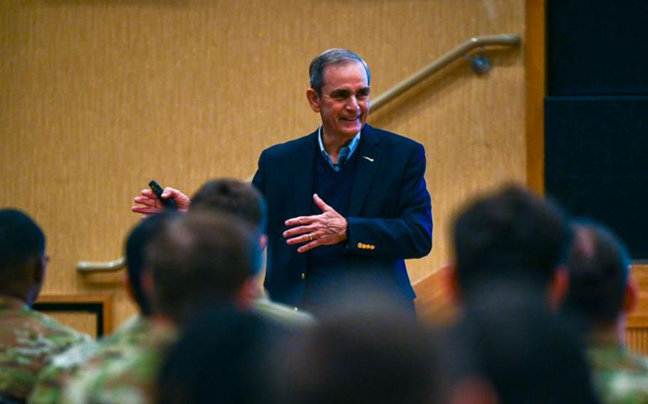 U.S. Air Force retired Col. Lee Ellis shares his experiences and insights with gestures.