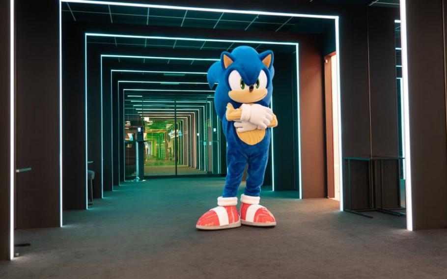 Sonic stands with its arms folded.