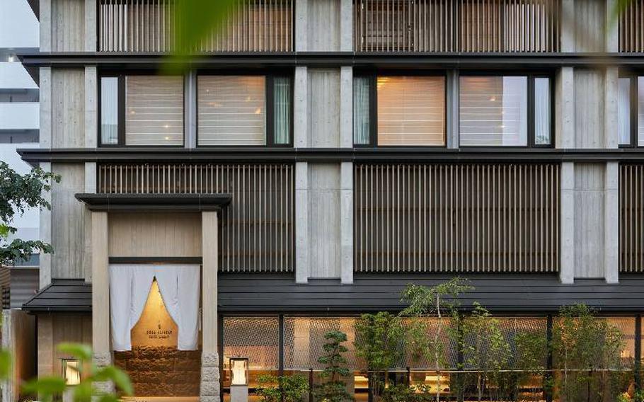 A curtain hangs at the entrance, welcoming guests to Onsen Ryokan Yuen Sapporo.