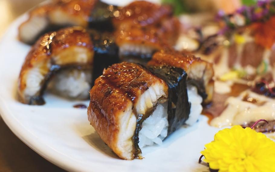 Unagi sushi on a plate.