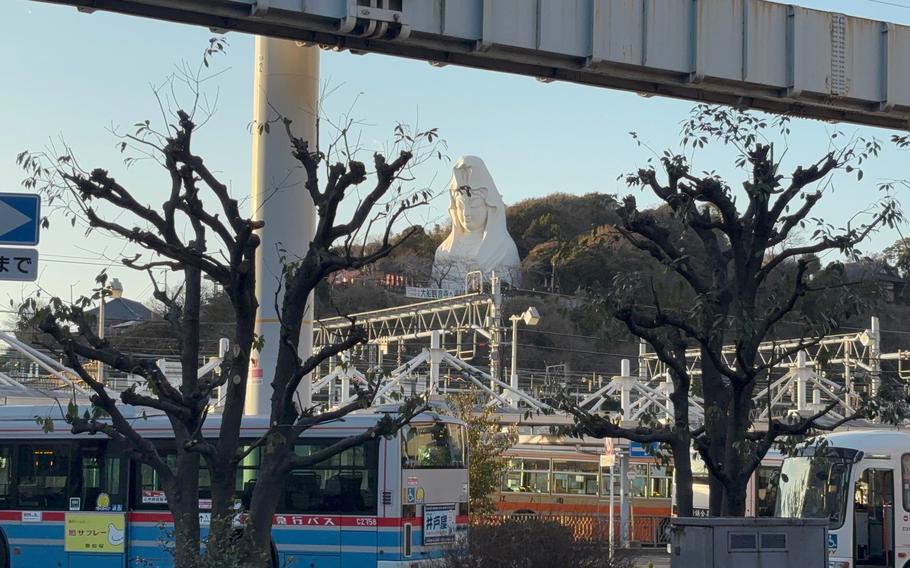 the statue can be seen from the street.