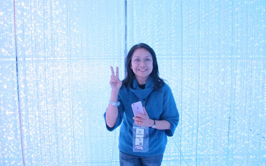 A woman enjoys one of the exhibitions at teamLab Planets.