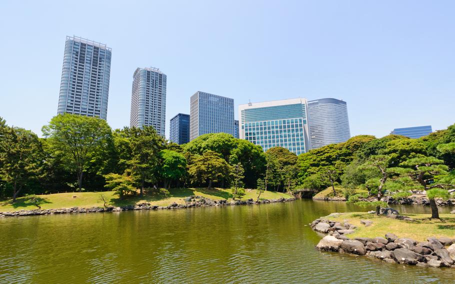 Some buildings can be seen behind the Hamarikyu Gardens.
