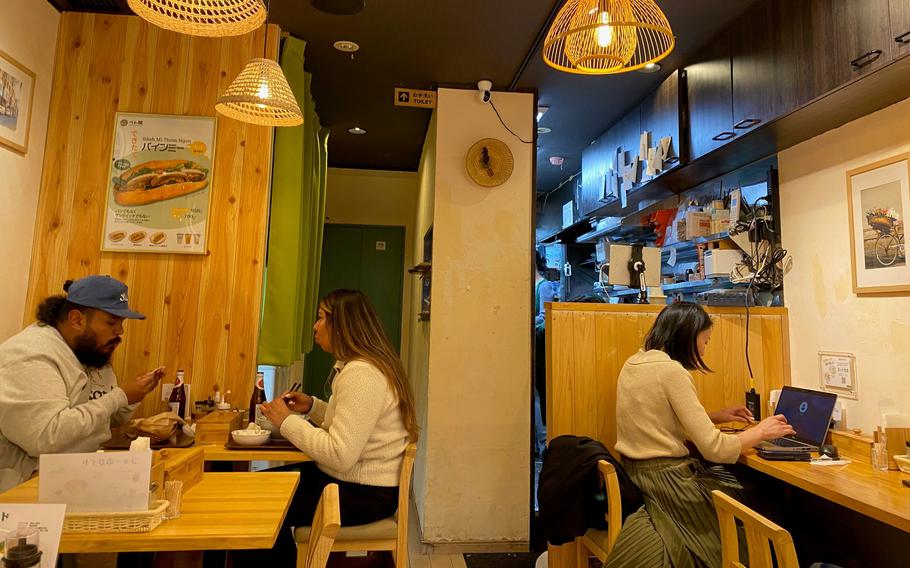 Customers enjoy meals at Viet Quan.