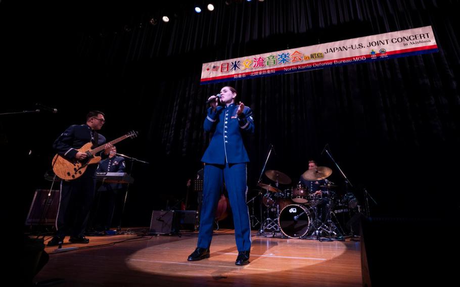 U.S. Air Force Senior Airman Erica Huseby, Band of the Pacific vocalist, performs during the Japan-U.S. Joint Music Concert at Foster Hall in Akishima, Tokyo, Japan, Feb. 10, 2024. The annual Japan-U.S. Joint Concert acts as an avenue in strengthening the partnerships and alliances between Yokota Air Base and the local community.