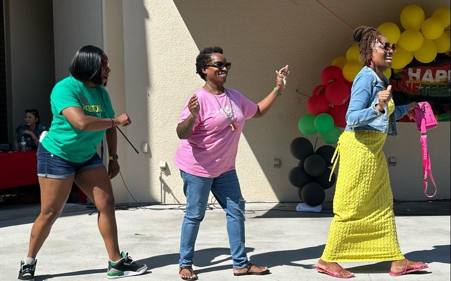 Community members dance after the formal portion of the Juneteenth Freedom Celebration June 19 at the Camp Zama Community Recreation Center amphitheater. 