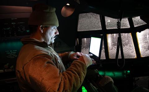 Photo Of Airman 1st Class Julian Gonzales conducts diagnostics inside the cockpit of a C-130J Super Hercules.