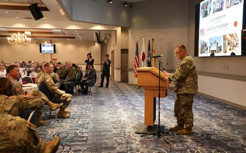 Photo Of Col. Stephen Browne, right, director of Plans and Policy for U.S. Forces Japan, speaks to the nearly 200 guests in attendance at the National Prayer Breakfast held May 2 at the Camp Zama Community Club.