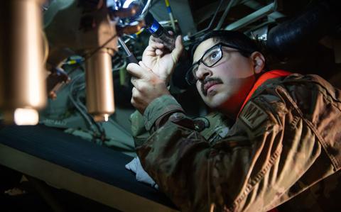 Photo Of Staff Sgt. Victor Sanchez conducts a thru-flight inspection at Yokota Air Base, Japan.