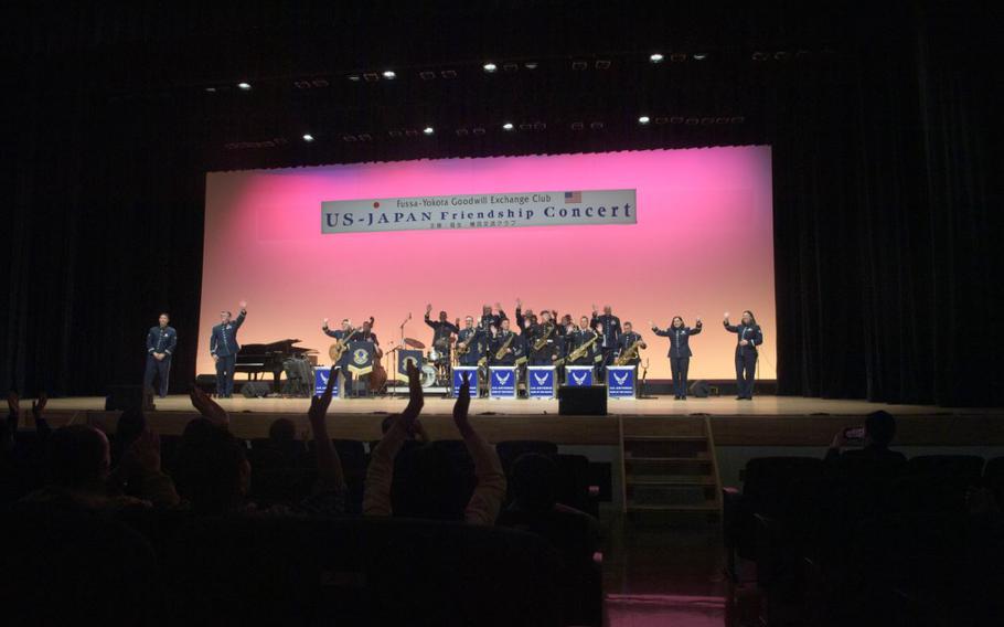 The U.S. Air Force Band of the Pacific waves goodbye to the audience after the U.S.-Japan Friendship Concert in Fussa City, Japan, April 24, 2025. Air Force bands strengthen bonds with allies and inspire long-lasting impressions of the U.S. Air Force by providing the public with live music. 