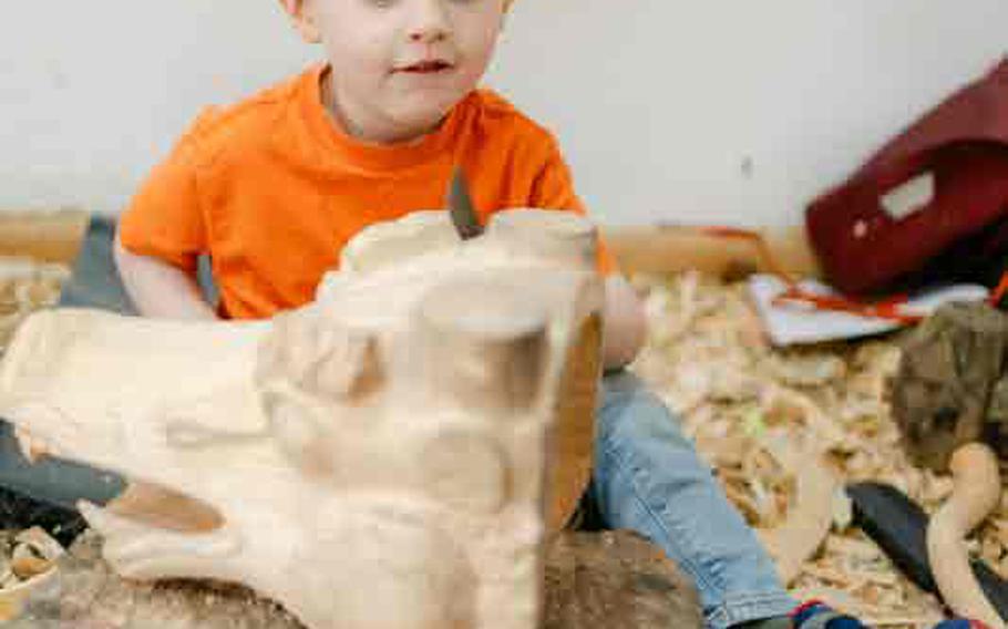 Our son working on his wood carving.