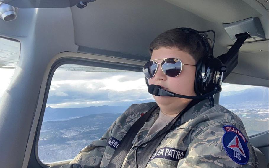 Civil Air Patrol Cadet Airman Jack “Bird” Sparrow flies a Cessna 172 toward Mount Fuji above Tokyo, Japan, Oct. 20-22, 2023. After reaching the designated altitude, the cadets were able to navigate toward iconic landmarks such as the Great Buddha Statue, Tokyo Tower, Sagami Bay, and Mount Fuji.
